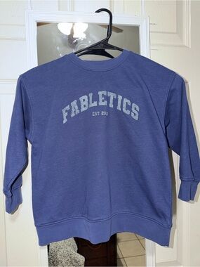 Fabletics Girls’ Crewneck Sweatshirt in Dusty Blue with Light Gray Logo